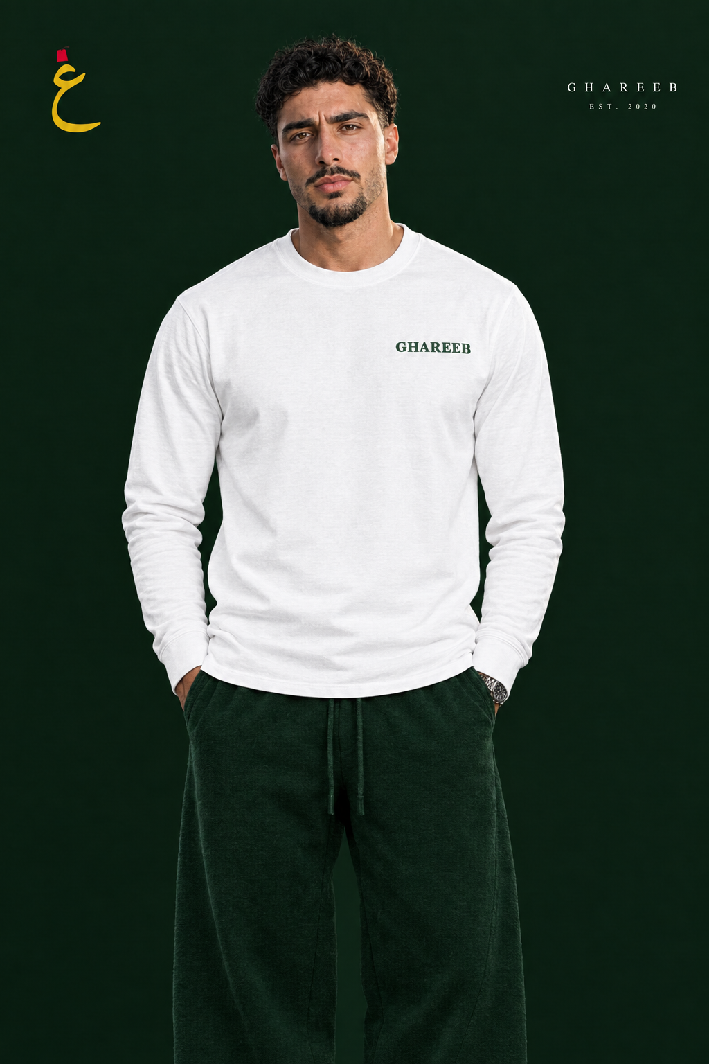 GHAREEB white long-sleeve T-shirt styled with green sweatpants